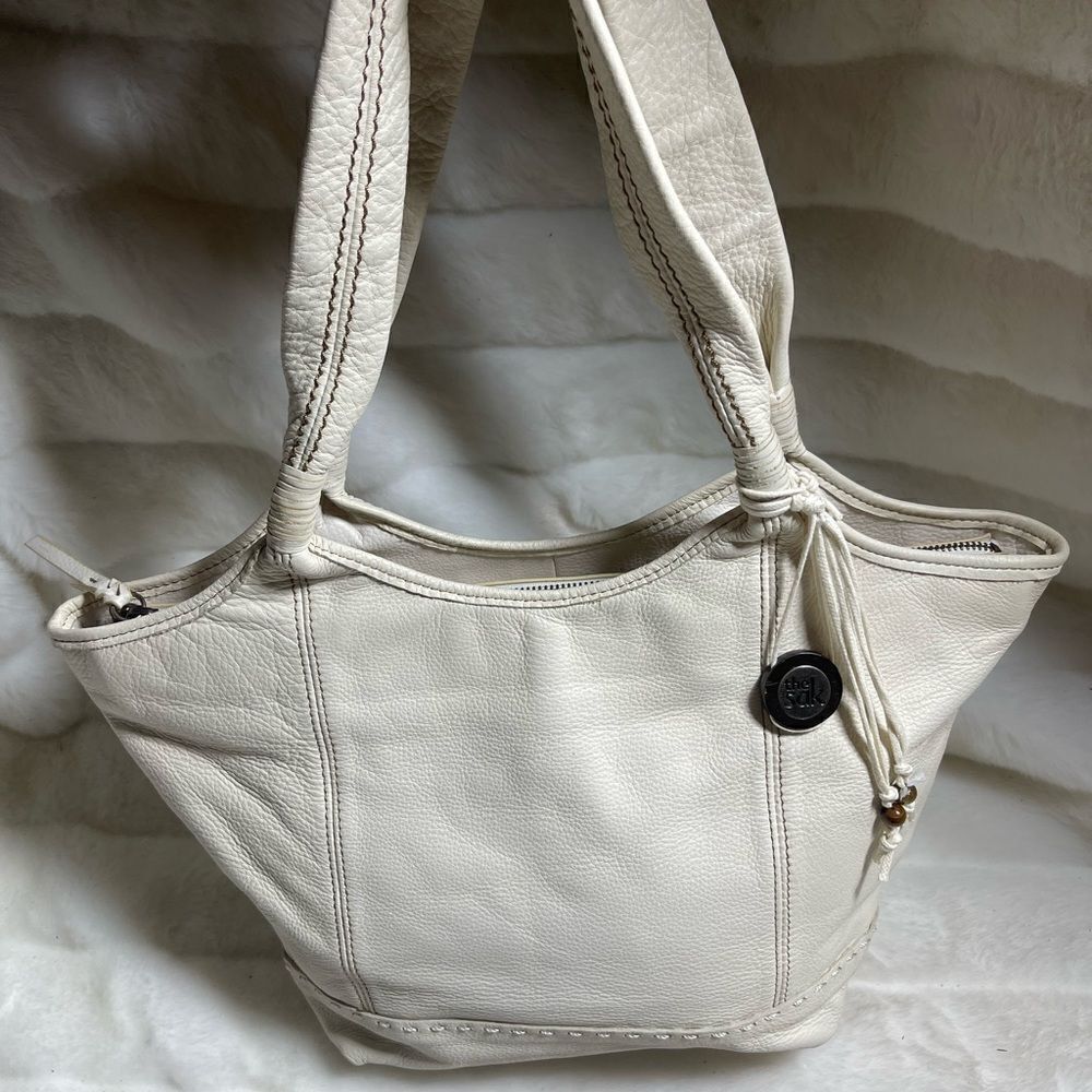 The SAK soft pebble leather beige shoulder bag with stitch accents.